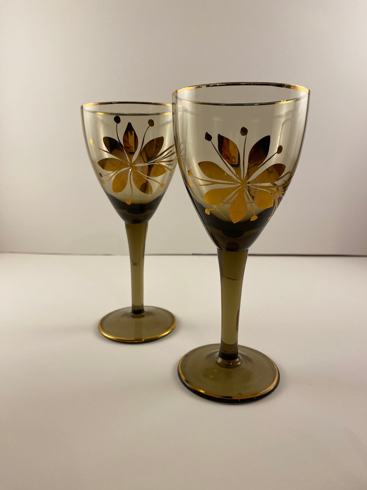 Vintage MCM wine glasses, Smokey Amber with gold foil flower design.  Set of 2